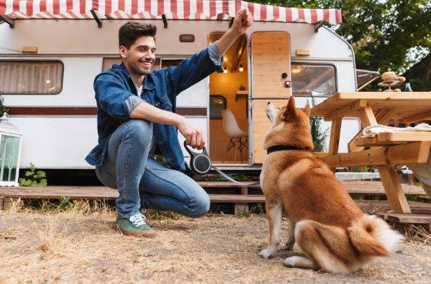 Camper and guy with his dog for walking